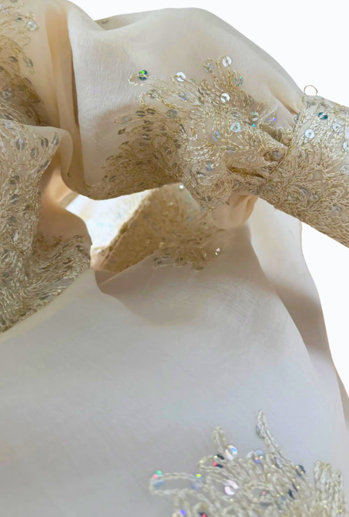 Elegant blouse and trouser set with shiny details